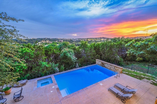 1101 Sprague Ln, West Lake Hills, TX 78746 - pool at dusk with a patio and an in-ground hot tub