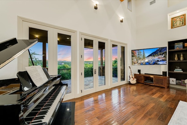 1101 Sprague Ln, West Lake Hills, TX 78746 - living area with french doors, wood finished floors, and a towering ceiling
