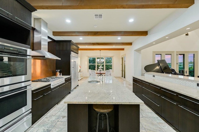 1101 Sprague Ln, West Lake Hills, TX 78746 - kitchen featuring appliances with stainless steel finishes, a sink, a warming drawer, wall chimney range hood, and recessed lighting
