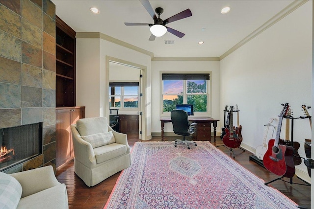 1101 Sprague Ln, West Lake Hills, TX 78746 - office area with crown molding, dark wood-type flooring, a tiled fireplace, recessed lighting, and a ceiling fan