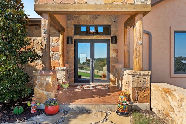 281 Cedar Mountain Dr, Marble Falls, TX 78654 - view of exterior entry with french doors and stone siding