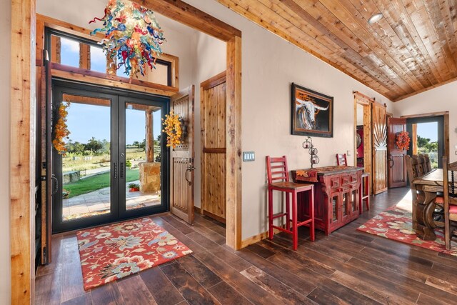 281 Cedar Mountain Dr, Marble Falls, TX 78654 - entrance foyer with french doors, wooden ceiling, lofted ceiling, wood finished floors, and baseboards