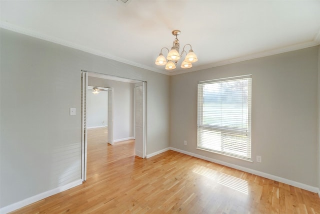 4020 Far W Blvd, Austin, TX 78731 - spare room featuring a chandelier, ornamental molding, and light wood-style flooring
