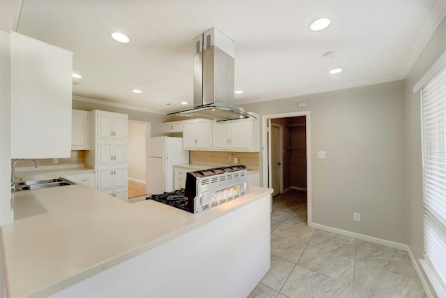 4020 Far W Blvd, Austin, TX 78731 - kitchen featuring a sink, freestanding refrigerator, island exhaust hood, crown molding, and backsplash