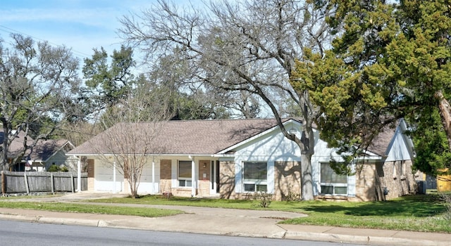 4020 Far W Blvd, Austin, TX 78731 - view of front of property with brick siding, a garage, roof with shingles, and concrete driveway