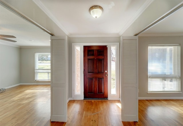 4020 Far W Blvd, Austin, TX 78731 - entrance foyer featuring light wood finished floors, a ceiling fan, and crown molding