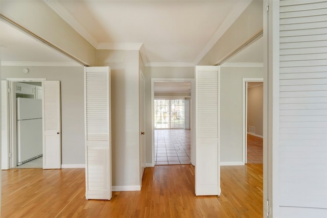 4020 Far W Blvd, Austin, TX 78731 - hallway with light wood finished floors, ornamental molding, and baseboards
