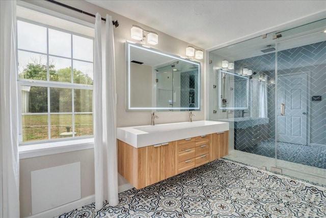 8204 Williamson Creek Dr, Austin, TX 78736 - full bathroom with double vanity, plenty of natural light, a stall shower, and tile patterned floors