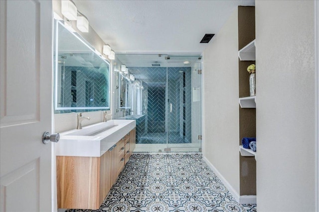 8204 Williamson Creek Dr, Austin, TX 78736 - bathroom featuring double vanity, a shower stall, tile patterned floors, and baseboards