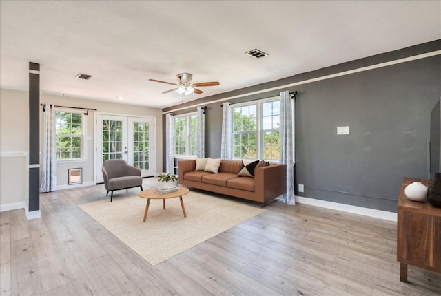 8204 Williamson Creek Dr, Austin, TX 78736 - living room with french doors, light wood-type flooring, ceiling fan, and baseboards