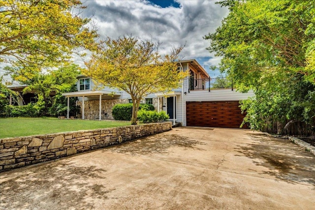 8204 Williamson Creek Dr, Austin, TX 78736 - view of front of house with a balcony, a front lawn, and driveway