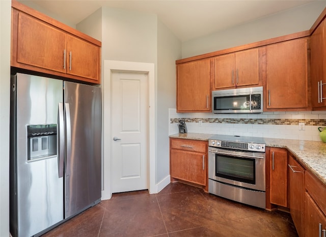 14410 Hunters Pass, Austin, TX 78734 - kitchen with appliances with stainless steel finishes, backsplash, and brown cabinets