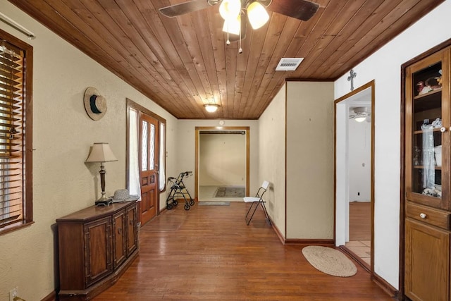 217 S Wilson St, San Marcos, TX 78666 - hallway featuring wooden ceiling, wood finished floors, and baseboards