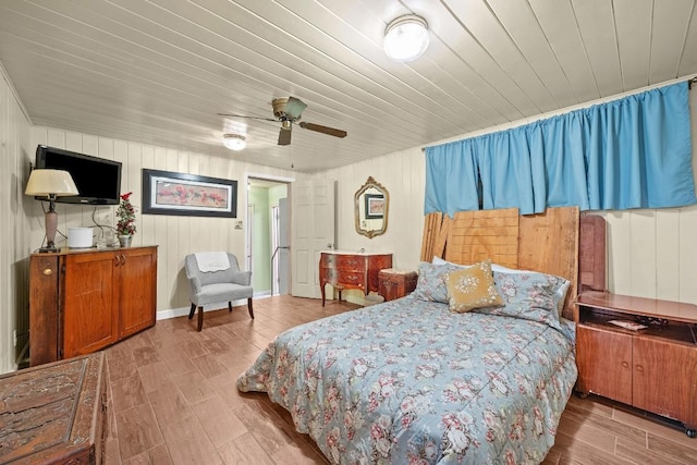 217 S Wilson St, San Marcos, TX 78666 - bedroom featuring wood finished floors, a ceiling fan, and wood ceiling