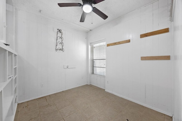 217 S Wilson St, San Marcos, TX 78666 - empty room featuring ceiling fan and a textured ceiling