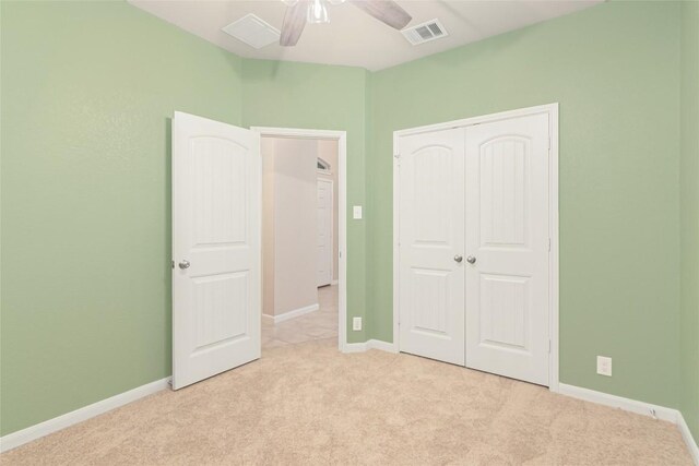 466 Sand Trl, New Braunfels, TX 78130 - unfurnished bedroom featuring light carpet, a closet, baseboards, and ceiling fan