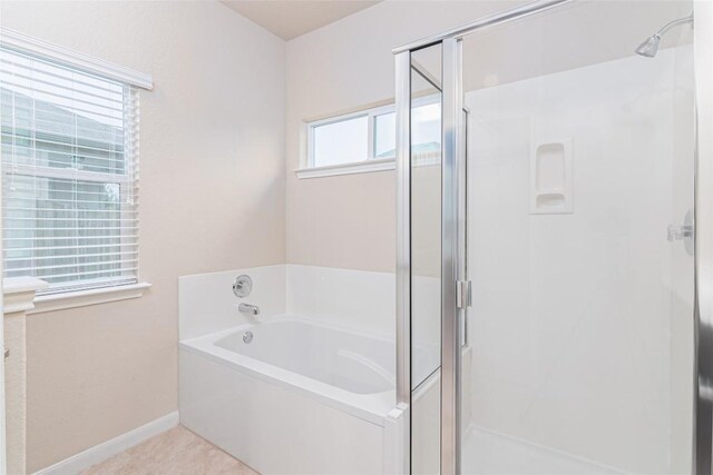 466 Sand Trl, New Braunfels, TX 78130 - full bathroom with a shower stall, a bath, and baseboards