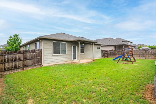 466 Sand Trl, New Braunfels, TX 78130 - rear view of house with a playground and a patio area