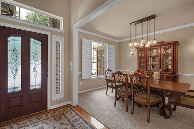 12709 Pinto Chase Ct, Austin, TX 78732 - entrance foyer featuring baseboards, ornamental molding, and wood finished floors