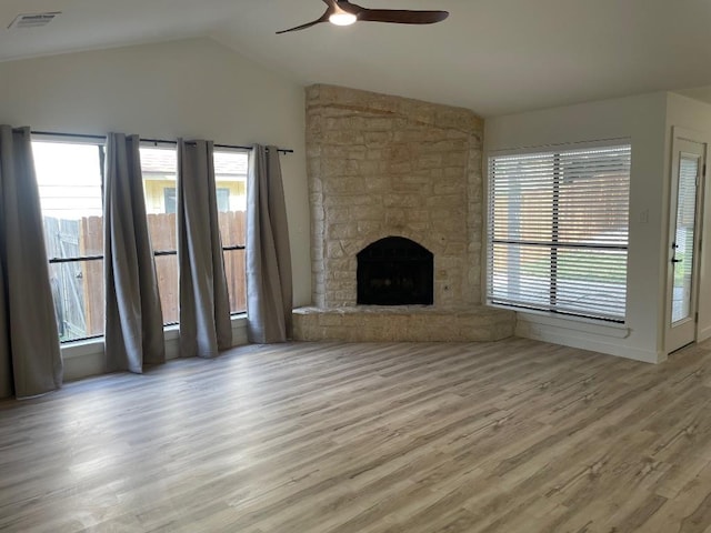 8527 Birmingham Dr, Austin, TX 78748 - unfurnished living room featuring a ceiling fan, wood finished floors, lofted ceiling, plenty of natural light, and a fireplace
