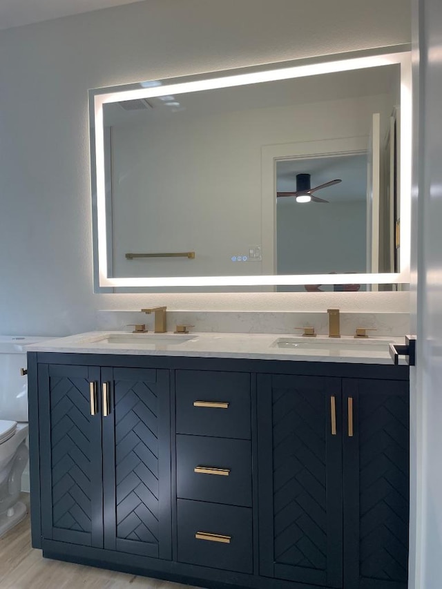 8527 Birmingham Dr, Austin, TX 78748 - bathroom featuring double vanity and a ceiling fan