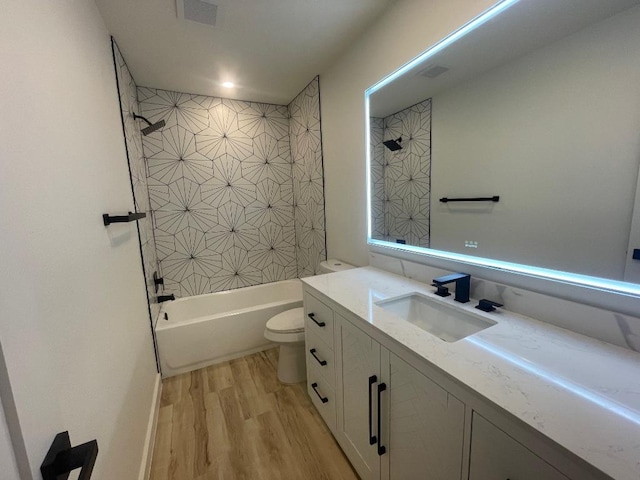 8527 Birmingham Dr, Austin, TX 78748 - bathroom featuring wood finished floors, vanity, and shower / bath combination
