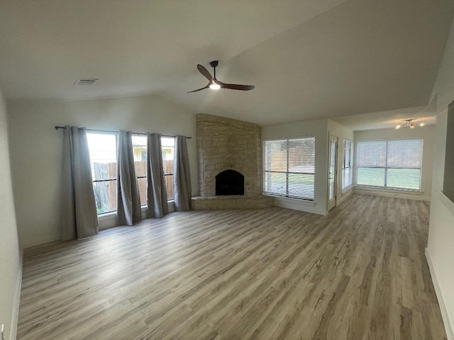 8527 Birmingham Dr, Austin, TX 78748 - unfurnished living room with ceiling fan, wood finished floors, lofted ceiling, and a fireplace