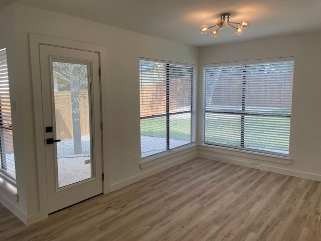 8527 Birmingham Dr, Austin, TX 78748 - entryway with a chandelier and light wood-style floors