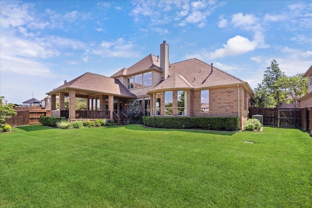331 Littleton Dr, Austin, TX 78737 - rear view of house with brick siding, a chimney, a fenced backyard, and a gazebo