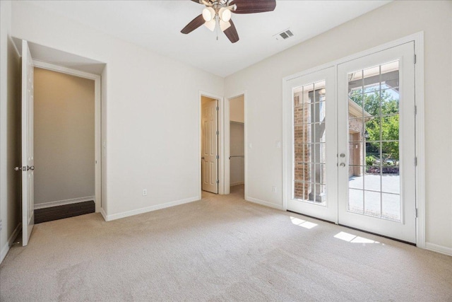 331 Littleton Dr, Austin, TX 78737 - unfurnished bedroom with french doors, carpet flooring, access to exterior, and baseboards