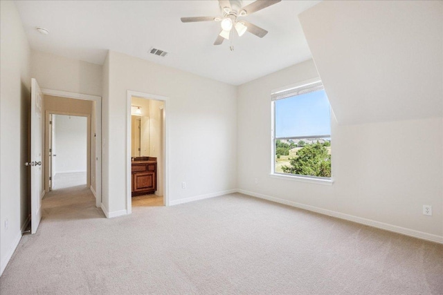 331 Littleton Dr, Austin, TX 78737 - unfurnished bedroom featuring light carpet, connected bathroom, and a ceiling fan