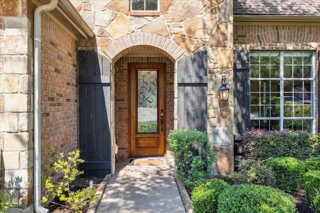 331 Littleton Dr, Austin, TX 78737 - entrance to property with brick siding, a shingled roof, and stone siding