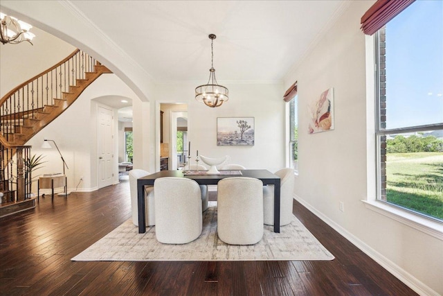 331 Littleton Dr, Austin, TX 78737 - dining area featuring a chandelier, stairs, arched walkways, hardwood / wood-style floors, and ornamental molding