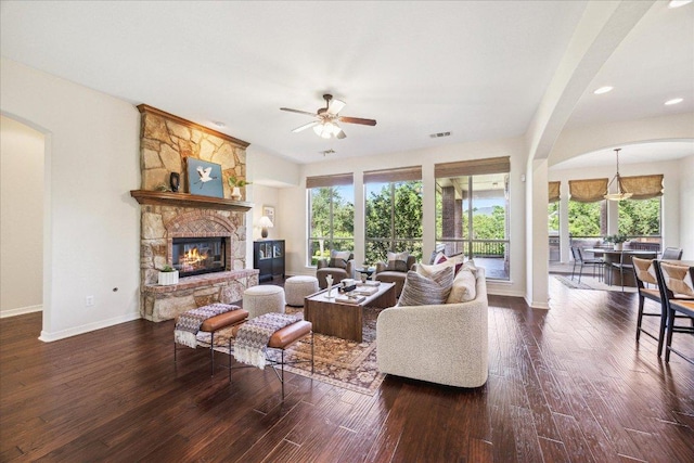 331 Littleton Dr, Austin, TX 78737 - living area featuring ceiling fan, arched walkways, wood-type flooring, a fireplace, and recessed lighting