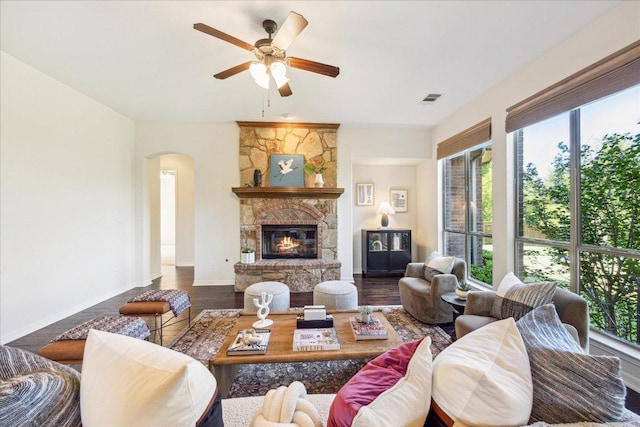 331 Littleton Dr, Austin, TX 78737 - living room featuring plenty of natural light, ceiling fan, arched walkways, and a stone fireplace