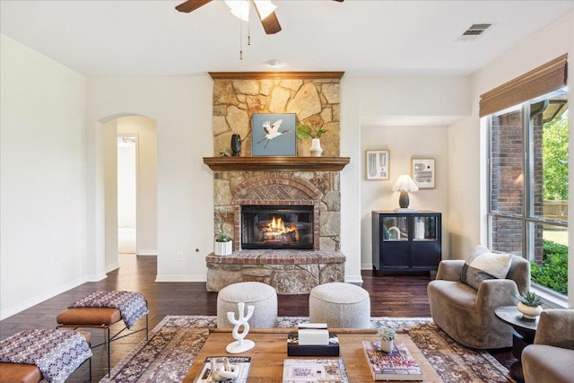 331 Littleton Dr, Austin, TX 78737 - living room with arched walkways, plenty of natural light, a ceiling fan, and wood finished floors