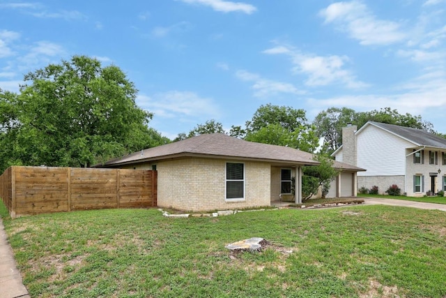 1301 S Meadows Dr, Austin, TX 78758 - view of front facade with concrete driveway, brick siding, and an attached garage