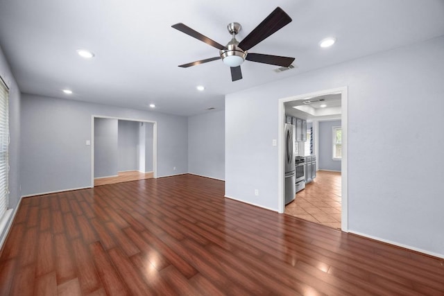 1301 S Meadows Dr, Austin, TX 78758 - unfurnished room with wood finished floors, recessed lighting, a ceiling fan, and baseboards