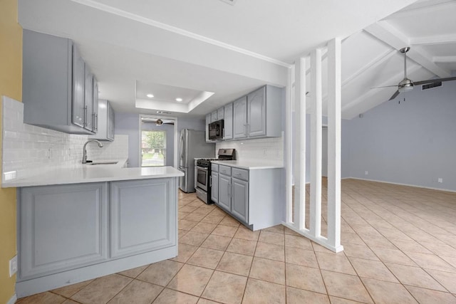 1301 S Meadows Dr, Austin, TX 78758 - kitchen with gray cabinetry, ceiling fan, stainless steel range with gas stovetop, black microwave, and a sink