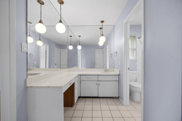 1301 S Meadows Dr, Austin, TX 78758 - bathroom with double vanity, tile patterned flooring, and toilet