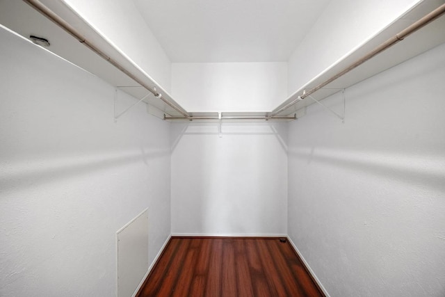 1301 S Meadows Dr, Austin, TX 78758 - walk in closet featuring wood finished floors