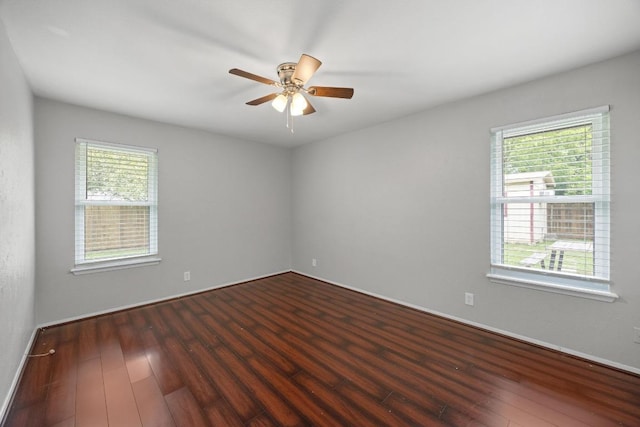 1301 S Meadows Dr, Austin, TX 78758 - unfurnished room with wood finished floors, ceiling fan, and baseboards
