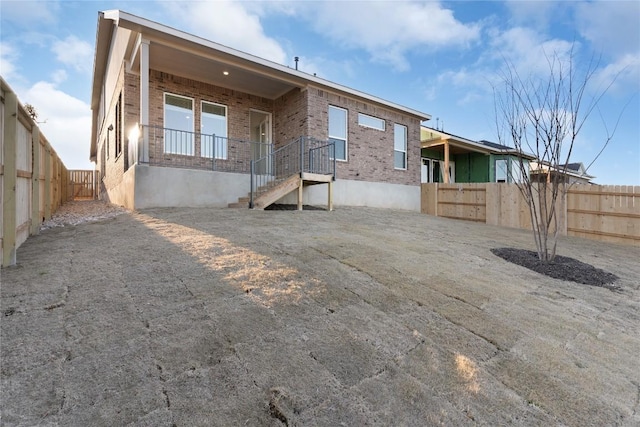 2705 Sage Ranch Dr Unit 20, Leander, TX 78641 - back of house featuring brick siding and a fenced backyard