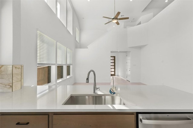 2705 Sage Ranch Dr Unit 20, Leander, TX 78641 - kitchen featuring dishwasher, a ceiling fan, light countertops, and a towering ceiling