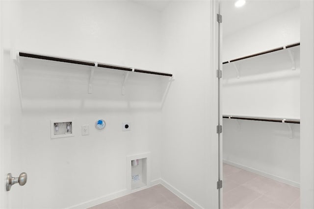 2705 Sage Ranch Dr Unit 20, Leander, TX 78641 - laundry area with hookup for a gas dryer, electric dryer hookup, washer hookup, and light tile patterned floors