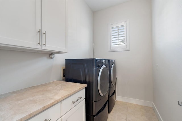 2520 Bluebonnet Ln Unit 58, Austin, TX 78704 - washroom featuring separate washer and dryer, cabinet space, and light tile patterned floors