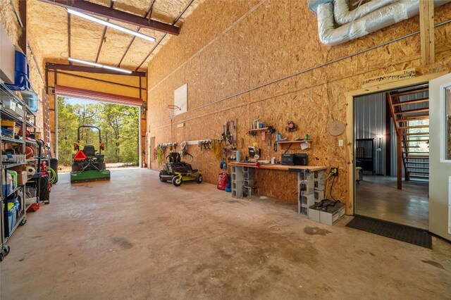 136 Red Fox Ln, Bastrop, TX 78602 - garage featuring a workshop area