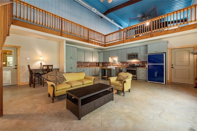 136 Red Fox Ln, Bastrop, TX 78602 - living area with a high ceiling and ceiling fan