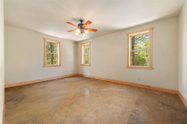 136 Red Fox Ln, Bastrop, TX 78602 - spare room featuring plenty of natural light, baseboards, and ceiling fan