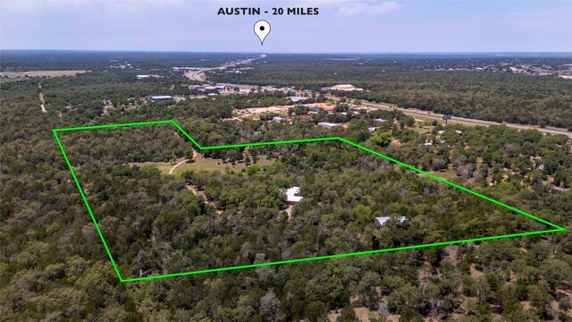 136 Red Fox Ln, Bastrop, TX 78602 - aerial view of property's location featuring property parcel outlined and a forest